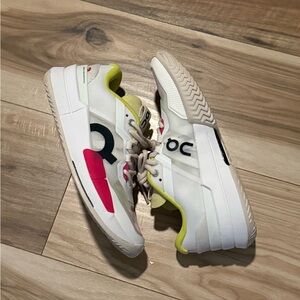 On Running White Sneakers with Pink and Yellow Accents
